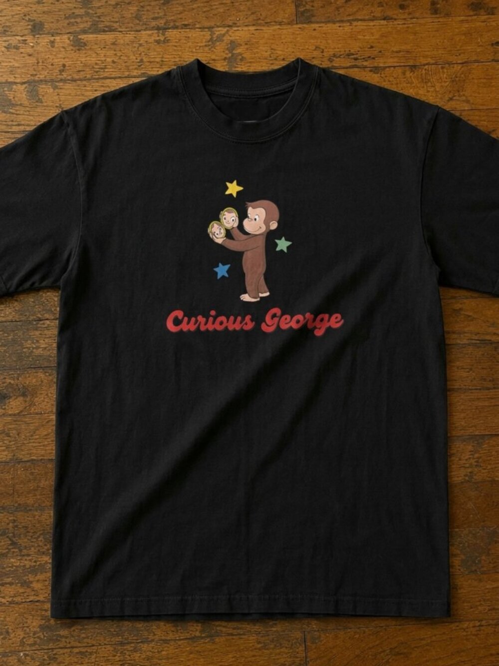 Curious George Peeling a Banana Modern Cartoon with Logo Toddler T-shirt